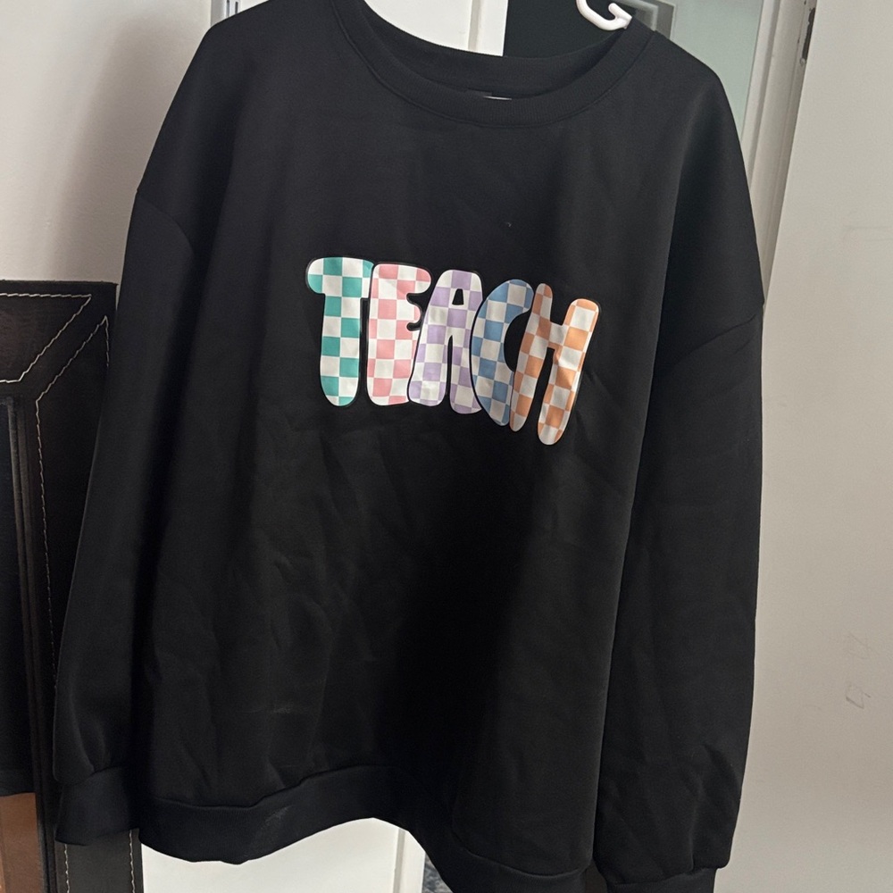 SHEIN Black Sweatshirt with Colorful Checkered 'TEACH' Design